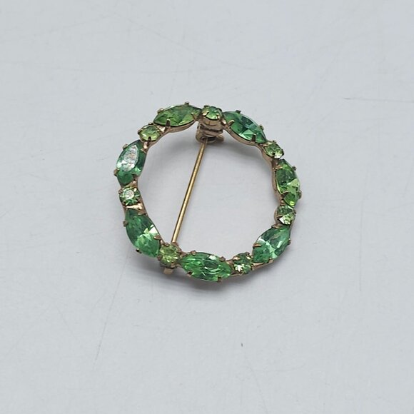 Vintage Gold Tone Circle Brooch With Green Rhinestones - Picture 2 of 4